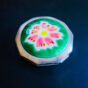Nacon vintage cloisonné compact with pink flower motif on green background, octagonal shape, Showa era (1960s).