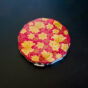 Crown compact with gold floral design on a red enamel base (mid-Showa era)