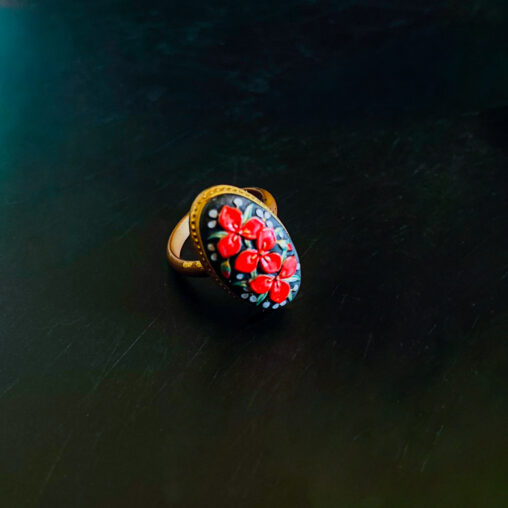 Vintage Toshikane ring with a raised red flower on a black ground, Showa era, mid-20th century Japan